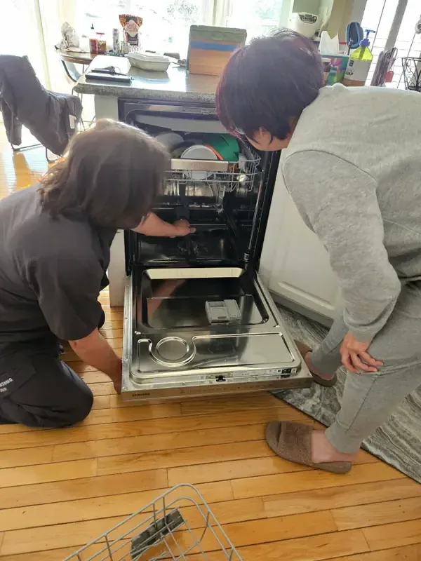 Mid America Service technician repairing a dishwasher in St. Louis, Missouri